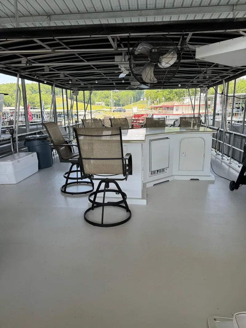 Slide: The Image of Upper deck of a 2003 Sharpe 75' Houseboat with bar and seating area. - 17