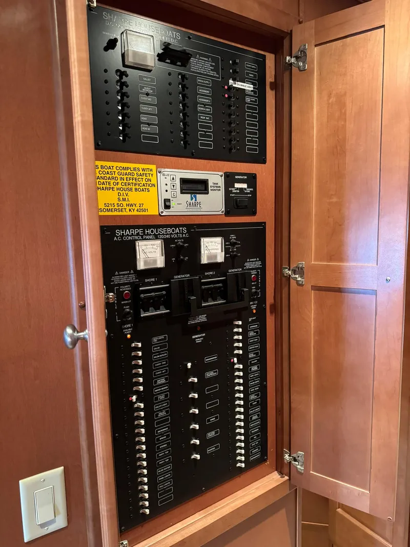 Slide: The Image of Electrical control panel inside a 2003 Sharpe 75' Houseboat. - 35