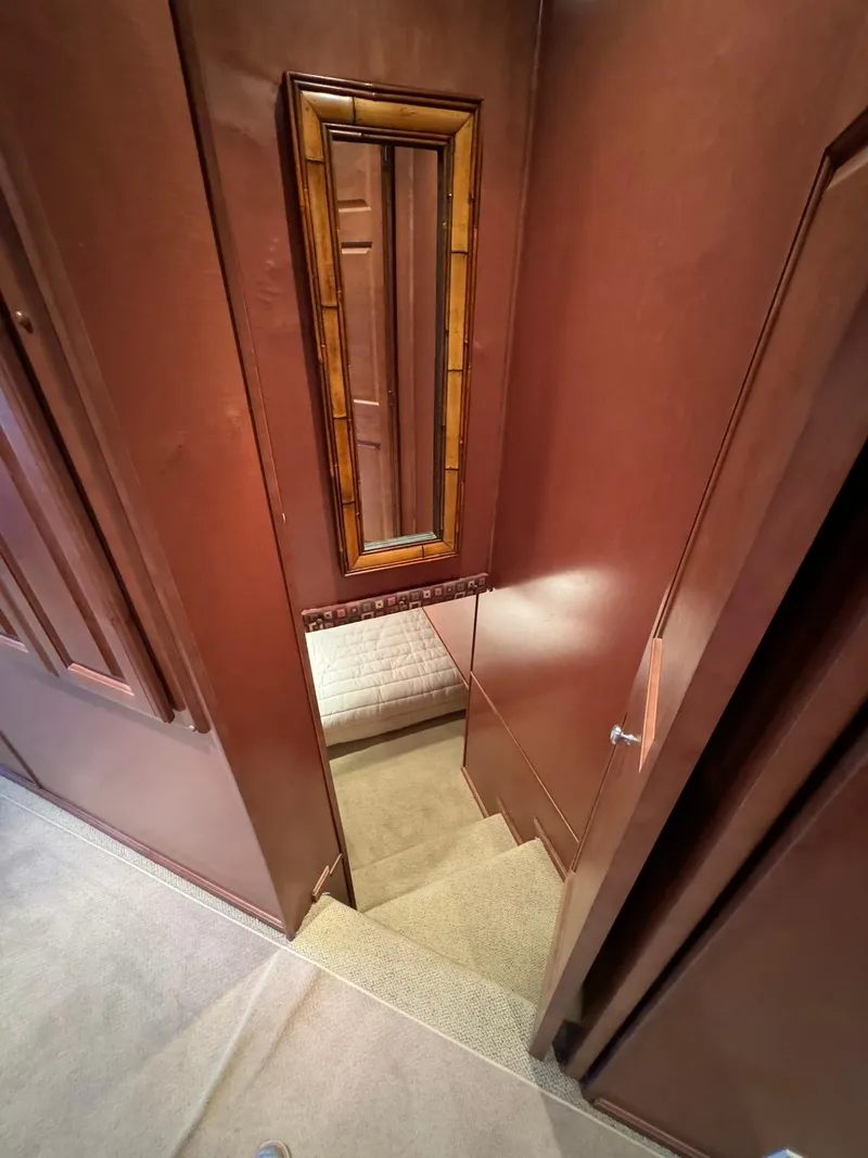 Slide: The Image of Staircase inside 2003 Sharpe 75' Houseboat with wooden walls and mirror. - 36
