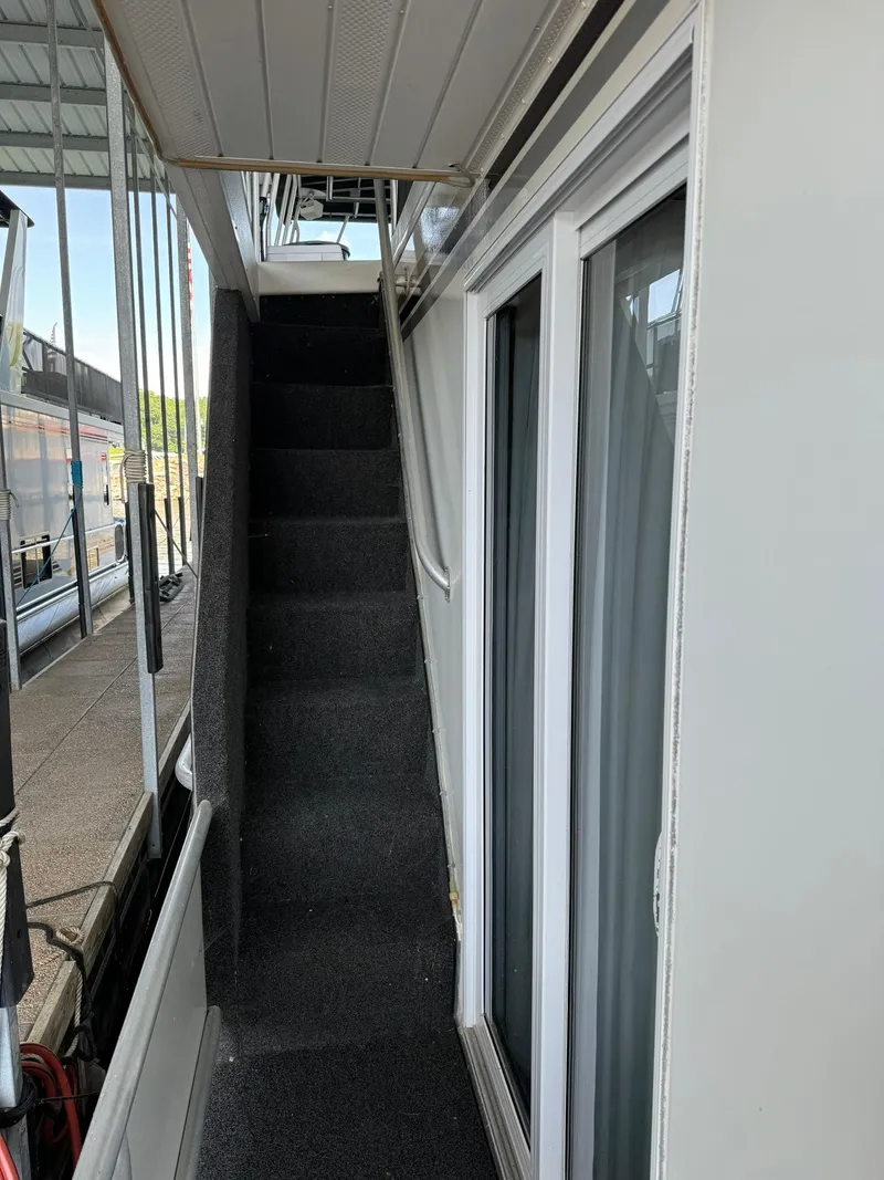 Slide: The Image of Staircase on a 2003 Sharpe 75' Houseboat leading to the upper deck. - 4