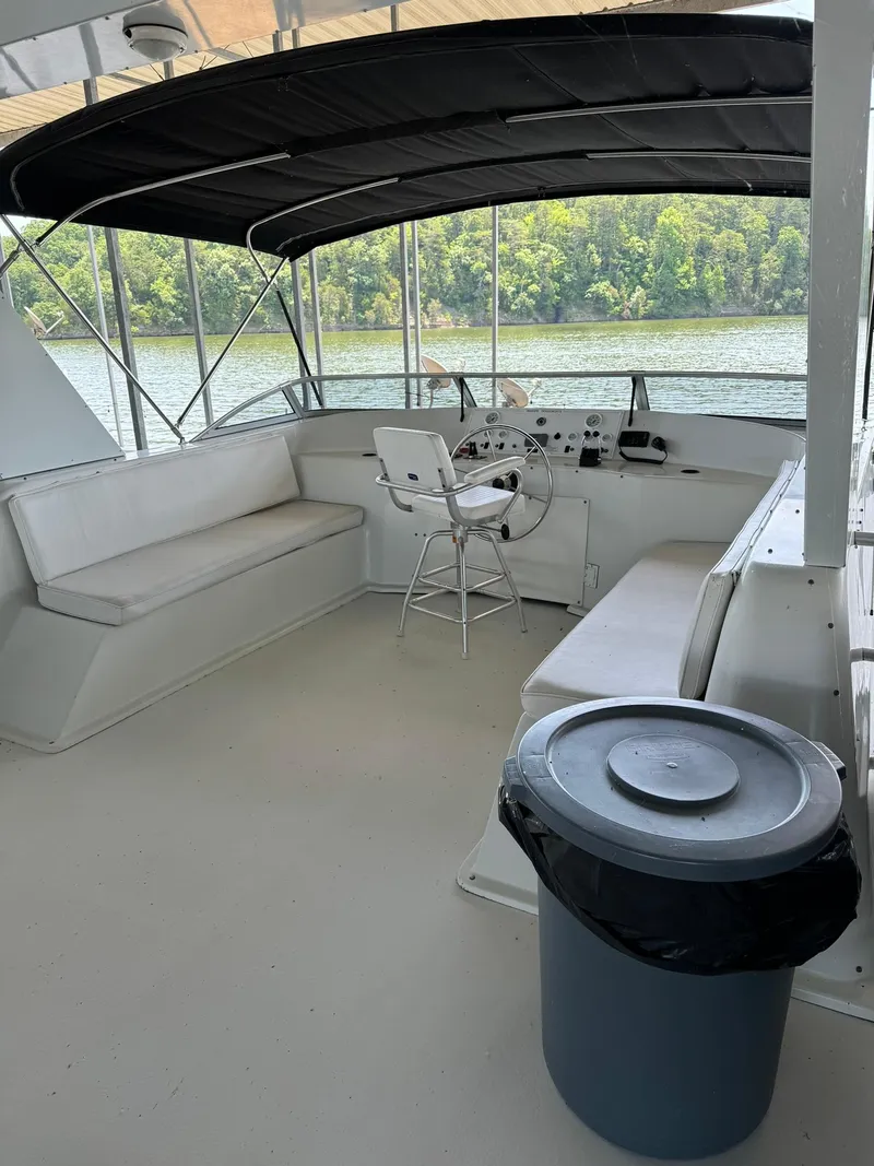Slide: The Image of 2003 Sharpe 75' Houseboat helm area with seating and lake view. - 8