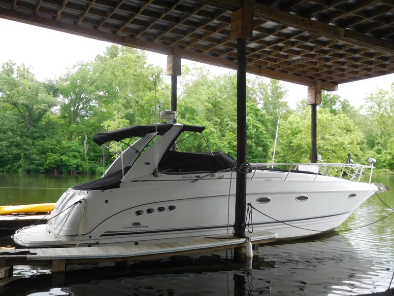 Slide: The Image of 2006 Chaparral 350 Signature boat docked under a covered marina. - 0