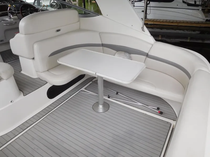 Slide: The Image of 2006 Chaparral 350 Signature boat interior with white seating and table. - 11