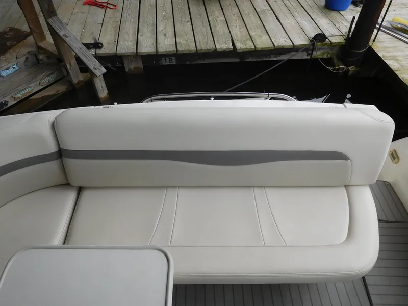 Slide: The Image of 2006 Chaparral 350 Signature boat interior seating near dock. - 15