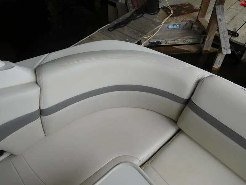 Slide: The Image of 2006 Chaparral 350 Signature boat interior seating, white and gray upholstery. - 16