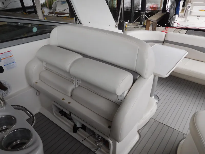 Slide: The Image of 2006 Chaparral 350 Signature boat interior with white seating and table. - 24