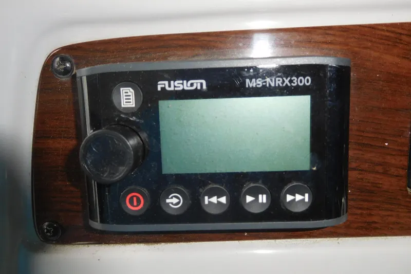 Slide: The Image of Fusion MS-NRX300 marine stereo control panel on 2006 Chaparral 350 Signature. - 28