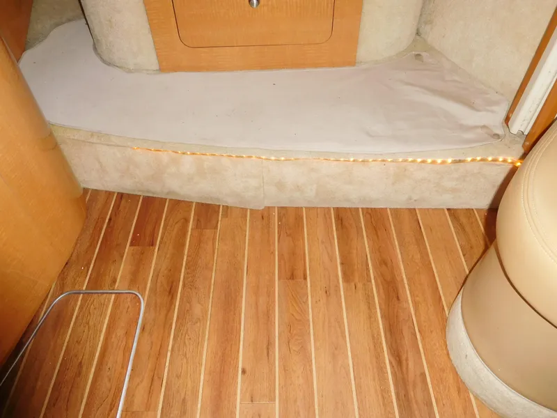 Slide: The Image of Interior of 2006 Chaparral 350 Signature with wooden flooring and beige upholstery. - 41