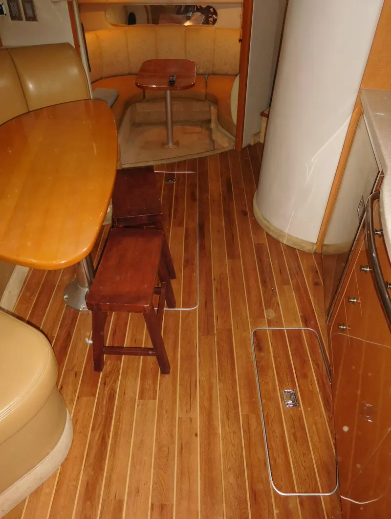 Slide: The Image of 2006 Chaparral 350 Signature yacht interior with wooden flooring and dining area. - 42