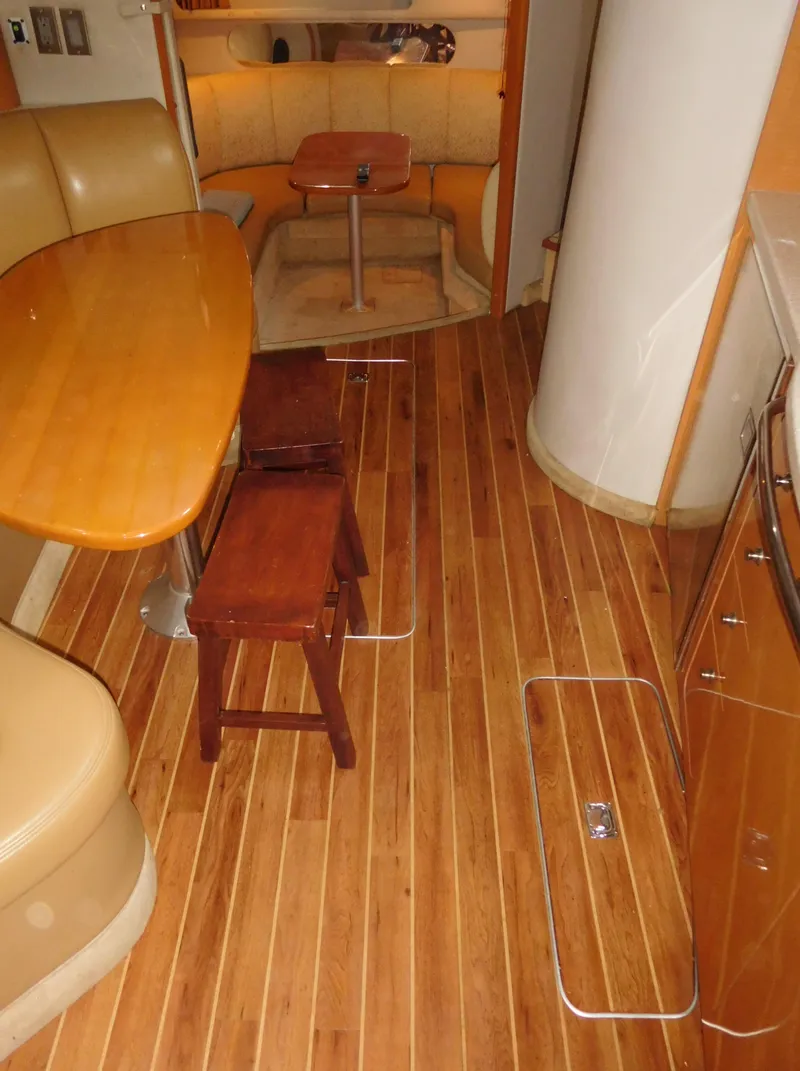Slide: The Image of 2006 Chaparral 350 Signature yacht interior with wooden flooring and dining area. - 43
