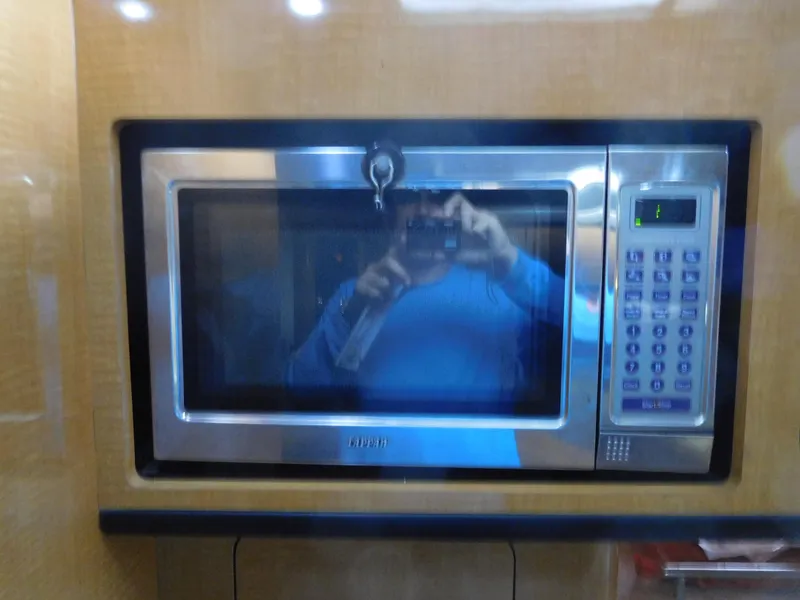 Slide: The Image of Built-in microwave in 2006 Chaparral 350 Signature boat kitchen. - 47