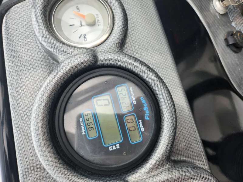 Slide: The Image of Close-up of 2015 Starcraft Crossover 210 SCX IO boat dashboard gauges. - 22