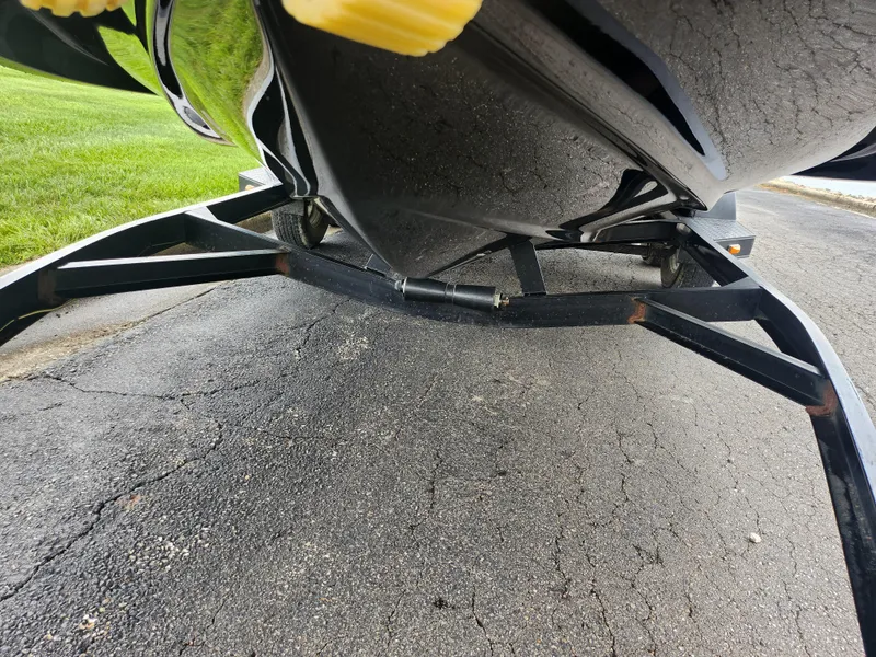 Slide: The Image of 2015 Starcraft Crossover 210 SCX IO boat on trailer, underside view. - 7