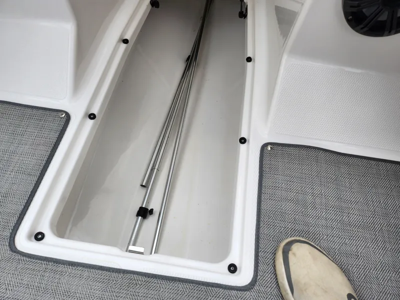 Slide: The Image of 2021 Campion Allante 20 Bowrider storage compartment with carpeted flooring. - 18