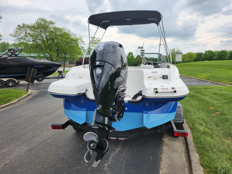 Slide: The Image of 2021 Campion Allante 20 Bowrider boat with outboard motor on trailer. - 2