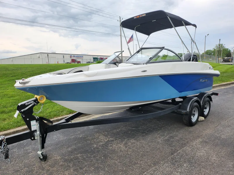 Slide: The Image of 2021 Campion Allante 20 Bowrider boat on a trailer with a bimini top. - 5