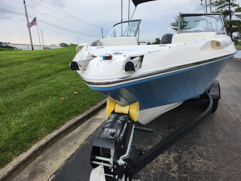 Slide: The Image of 2021 Campion Allante 20 Bowrider on trailer, parked on paved road near grass. - 6