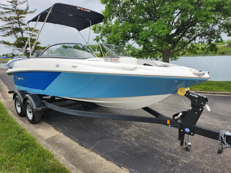 Slide: The Image of 2021 Campion Allante 20 Bowrider boat on trailer by a lake. - 8