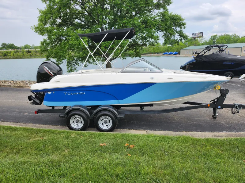 Slide: The Image of 2021 Campion Allante 20 Bowrider boat on trailer by a lake. - 9