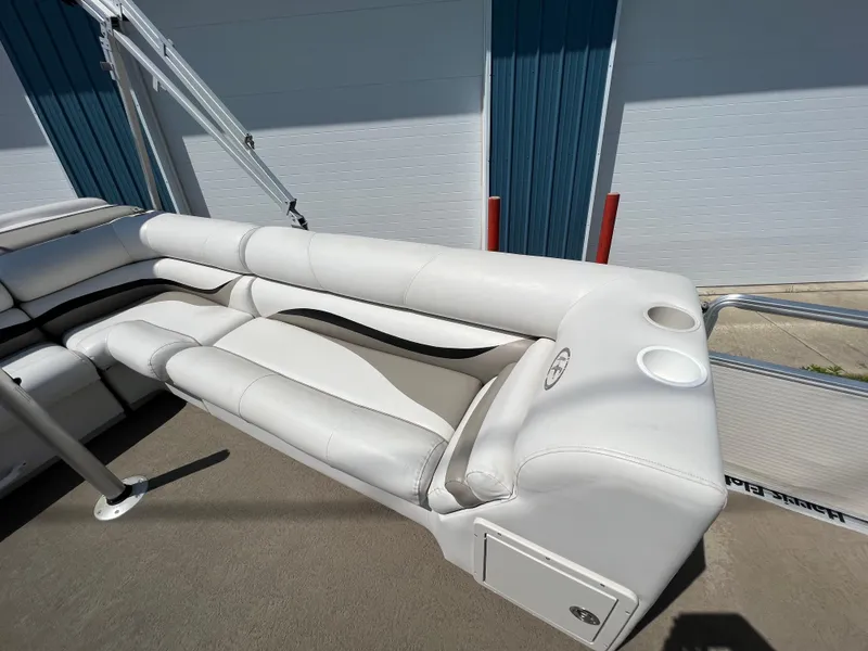 Slide: The Image of 2006 Harris FloteBote 250 Super Sunliner pontoon boat seating area with cup holders. - 16