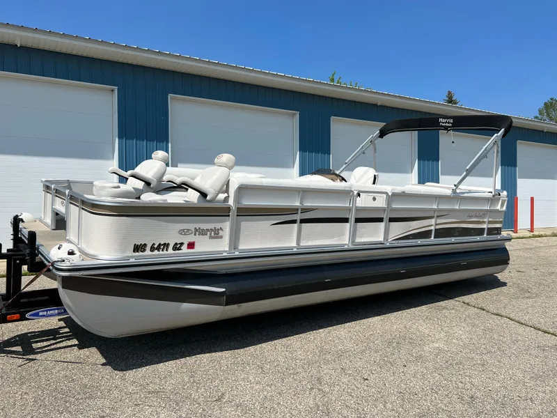 Slide: The Image of 2006 Harris FloteBote 250 Super Sunliner pontoon boat parked outside. - 21