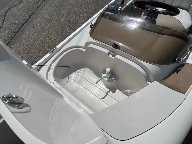 Slide: The Image of 2006 Harris FloteBote 250 Super Sunliner storage compartment and seating area. - 9