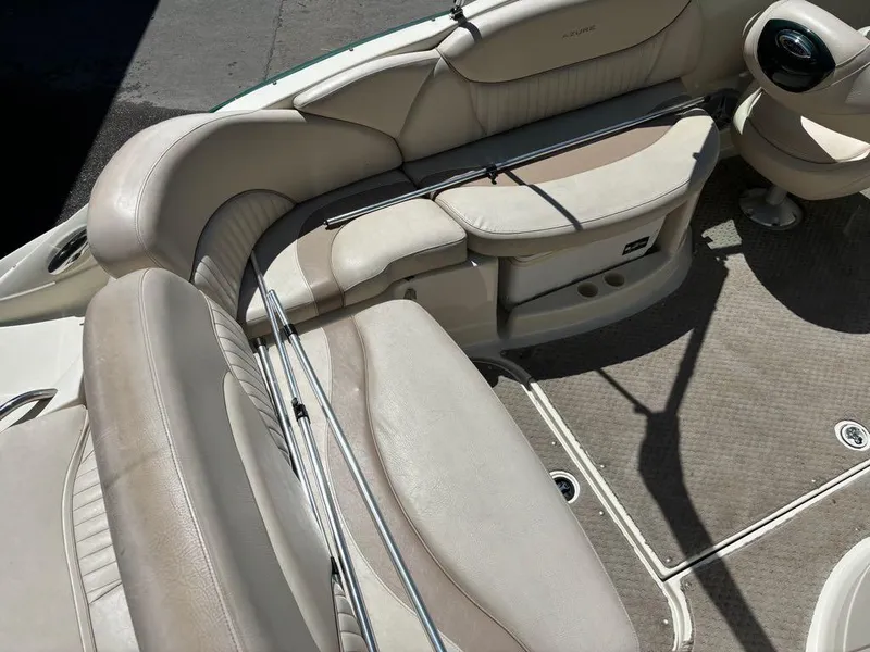 Slide: The Image of 2007 Azure AZ240 boat interior with beige leather seating and carpeted floor. - 10