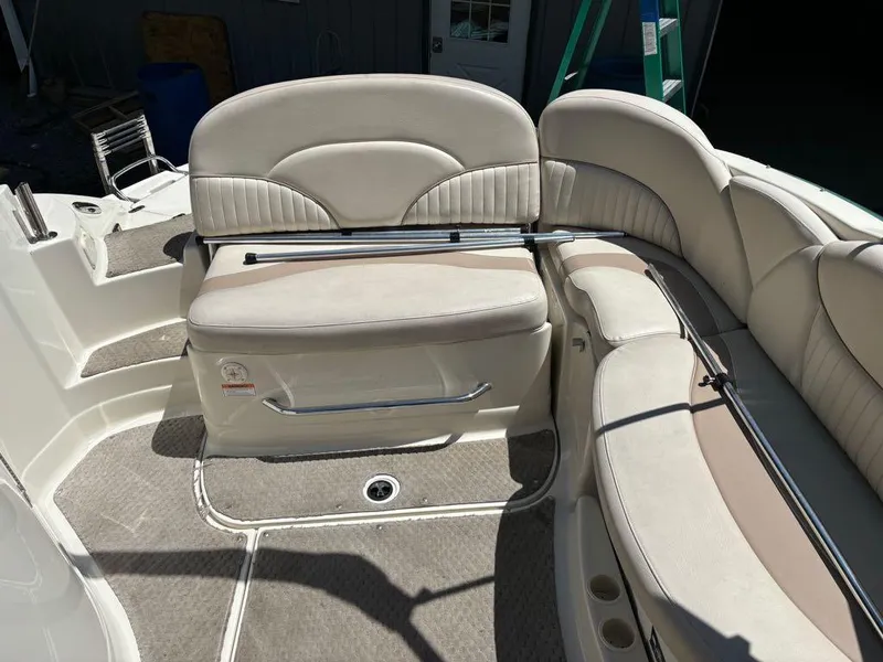Slide: The Image of 2007 Azure AZ240 boat interior with beige seating and carpeted flooring. - 12