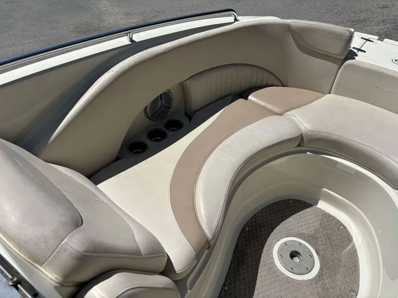 Slide: The Image of 2007 Azure AZ240 boat interior seating area with cup holders and speaker. - 14