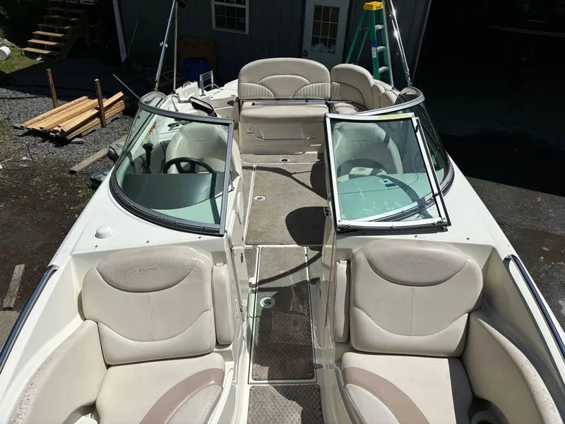 Slide: The Image of 2007 Azure AZ240 boat interior with beige seating and open windshield. - 17