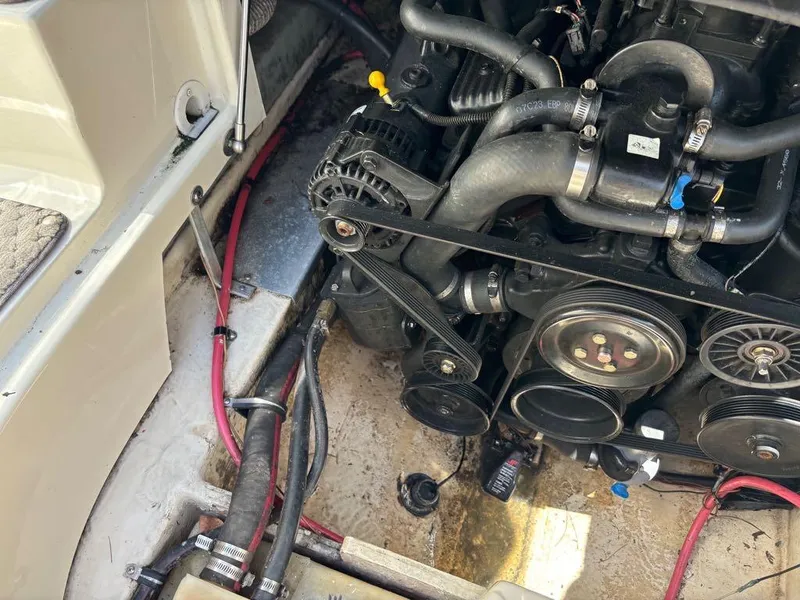 Slide: The Image of 2007 Azure AZ240 boat engine compartment with visible belts and hoses. - 19