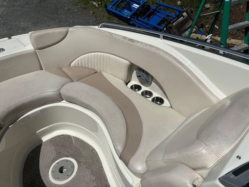 Slide: The Image of 2007 Azure AZ240 boat interior with beige seating and cup holders. - 20