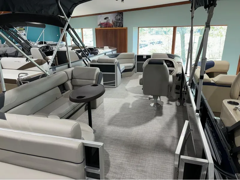 Slide: The Image of 2024 South Bay 200 Series S222CR2 pontoon boat interior with seating and helm. - 14