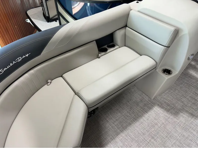 Slide: The Image of 2024 South Bay 200 Series S222CR2 boat interior seating with cup holders. - 16