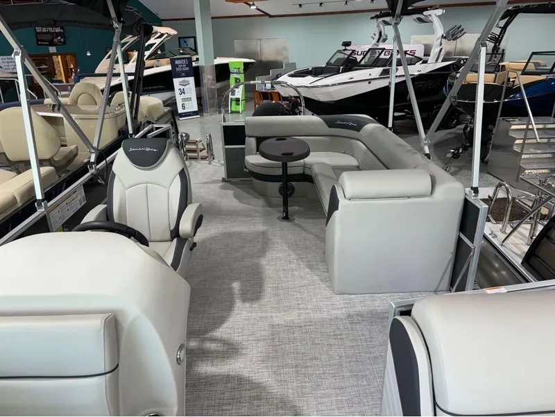 Slide: The Image of 2024 South Bay 200 Series S222CR2 pontoon boat interior with seating and helm. - 3