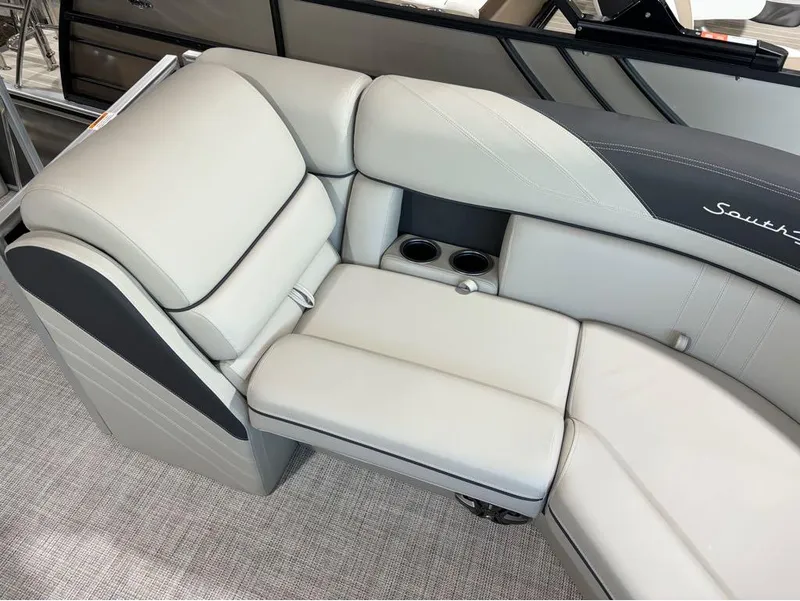 Slide: The Image of 2024 South Bay 200 Series S222CR2 boat interior seating with cup holders. - 6