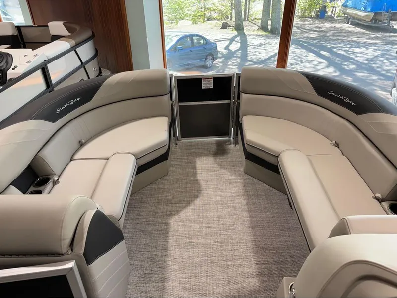 Slide: The Image of 2024 South Bay 200 Series S222CR2 pontoon boat interior with plush seating. - 7