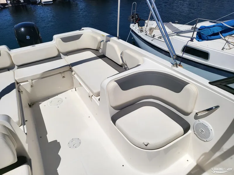 Slide: The Image of 2021 Bayliner E 21 boat interior with spacious seating and modern design. - 7