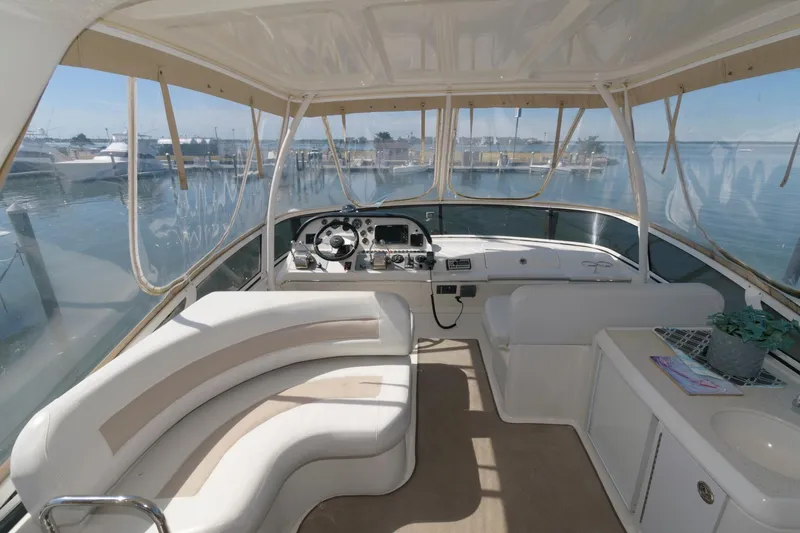 Slide: The Image of Interior of 2007 Carver 42 Super Sport yacht with helm and seating area. - 8