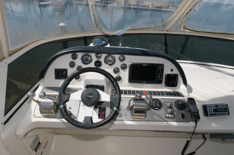 Slide: The Image of Helm of a 2007 Carver 42 Super Sport yacht with steering wheel and navigation instruments. - 11