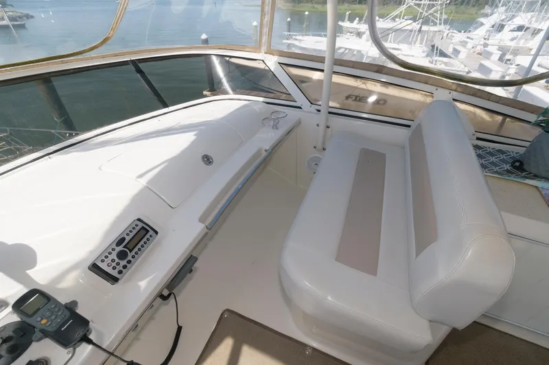 Slide: The Image of Interior helm of 2007 Carver 42 Super Sport yacht with seating and control panel. - 12