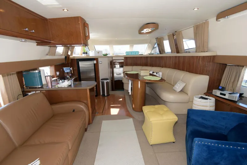Slide: The Image of Interior of a 2007 Carver 42 Super Sport yacht with modern furnishings. - 14