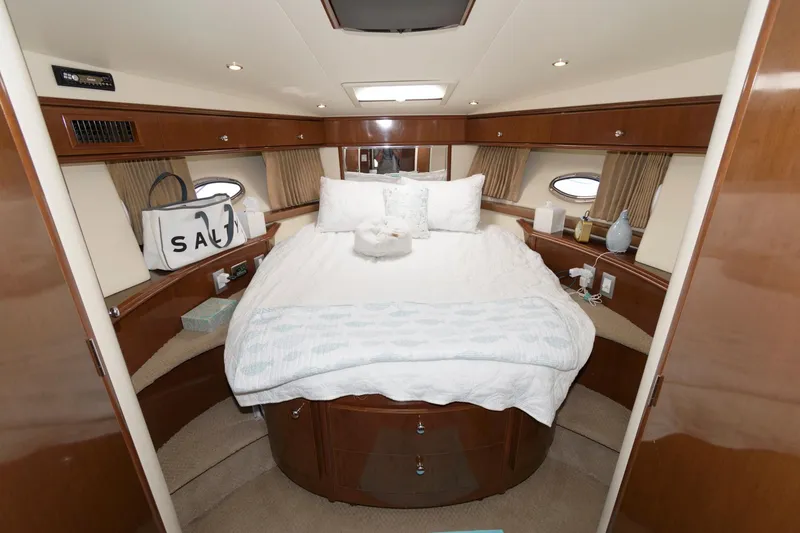 Slide: The Image of Luxurious bedroom in 2007 Carver 42 Super Sport yacht with cozy bed and elegant wood finish. - 20