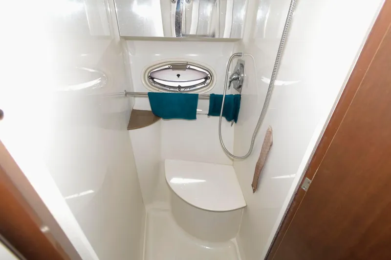 Slide: The Image of Compact bathroom with shower in 2007 Carver 42 Super Sport yacht. - 22