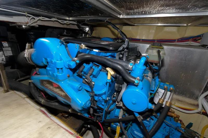 Slide: The Image of 2007 Carver 42 Super Sport engine compartment with blue engine. - 26