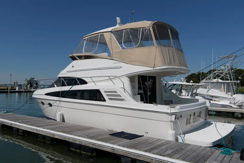 Slide: The Image of 2007 Carver 42 Super Sport yacht docked at marina. - 3