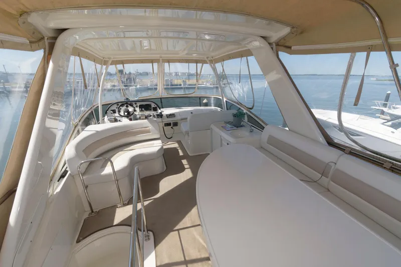 Slide: The Image of Interior of 2007 Carver 42 Super Sport yacht with spacious seating and helm station. - 6
