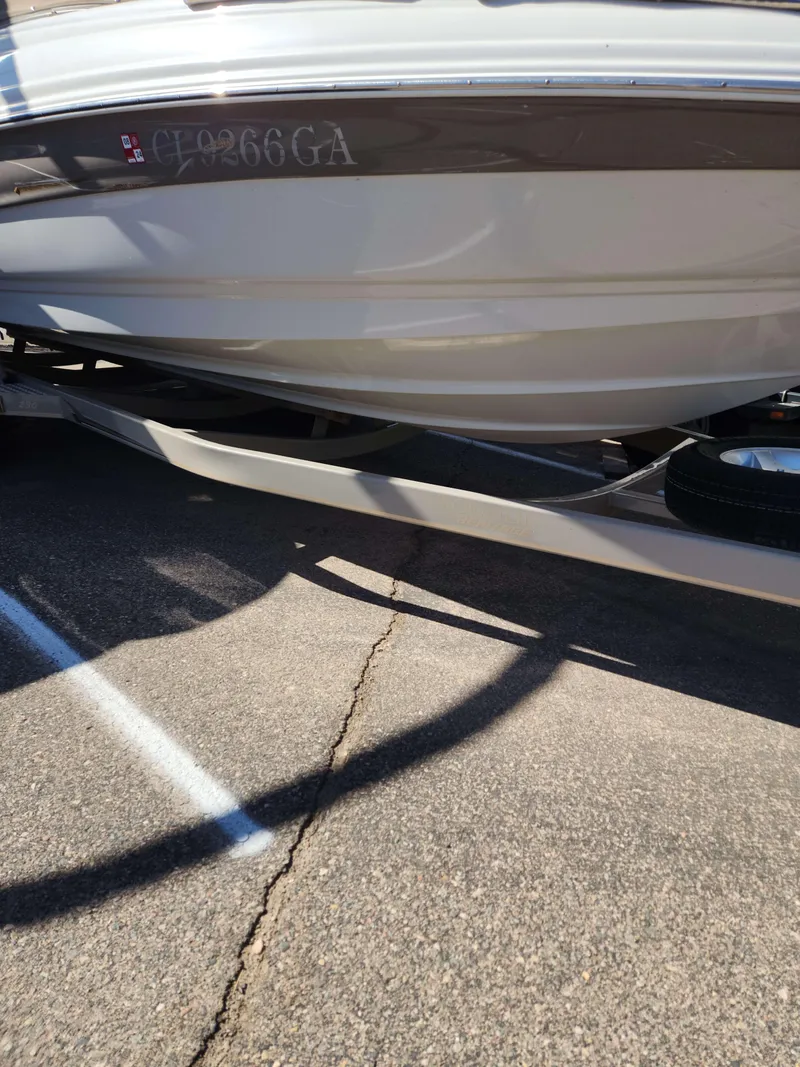 Slide: The Image of 2006 Crownline 230 LS boat on a trailer, side view. - 10