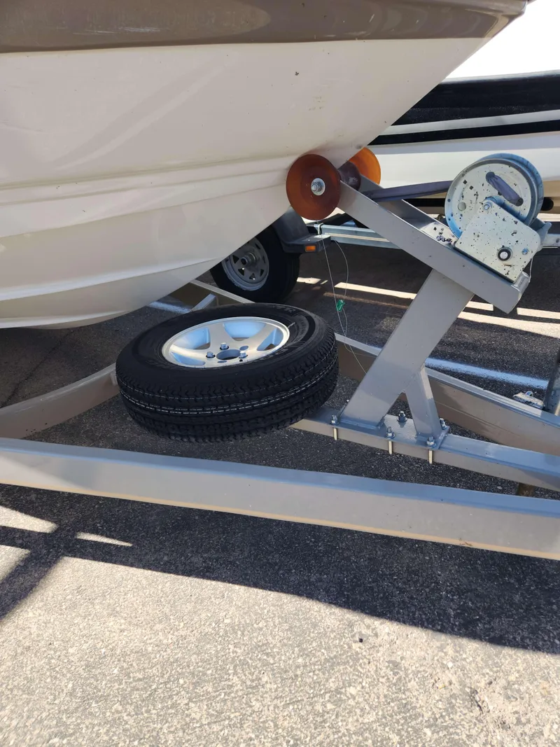 Slide: The Image of 2006 Crownline 230 LS boat on trailer with spare tire. - 5