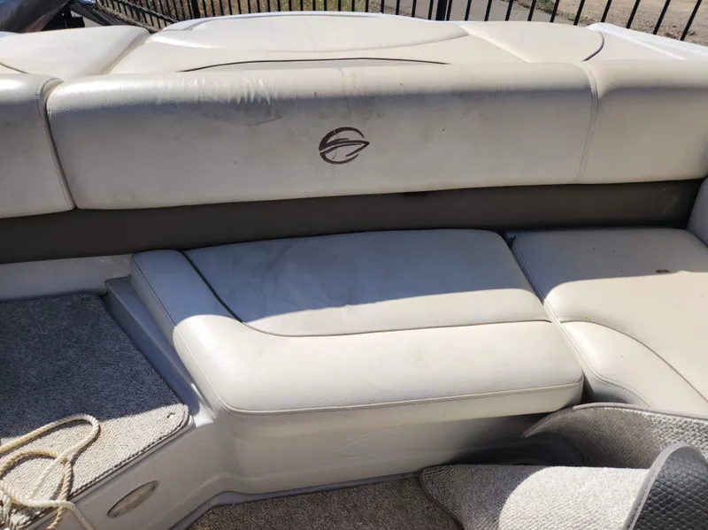Slide: The Image of 2006 Crownline 230 LS boat interior seating with logo. - 8